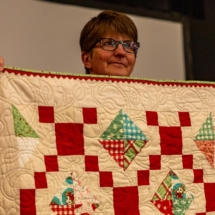 Lori F bejewled quilt using trim with the binding